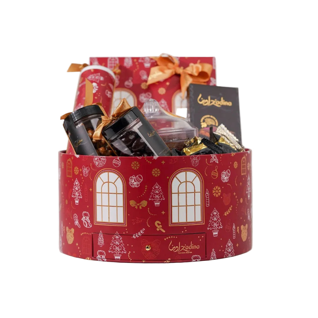 Red gift basket with festive design containing various items on a white background